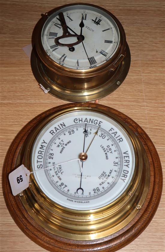 A ships aneroid barometer and a bulkhead clock